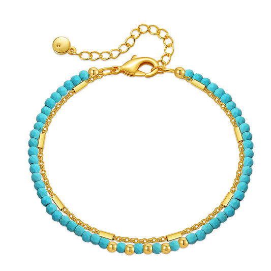 a gold and turquoise beaded bracelet