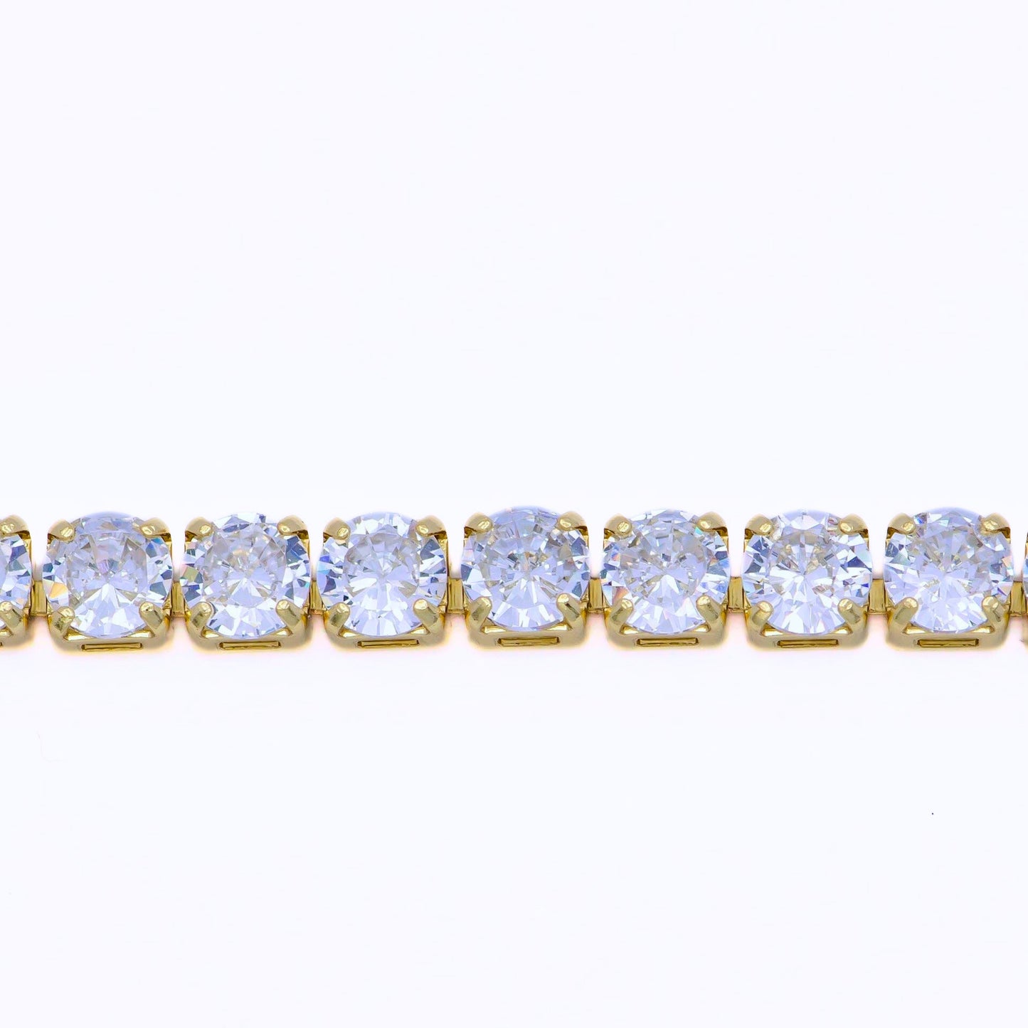 a yellow gold tennis bracelet with a row of CZ diamonds