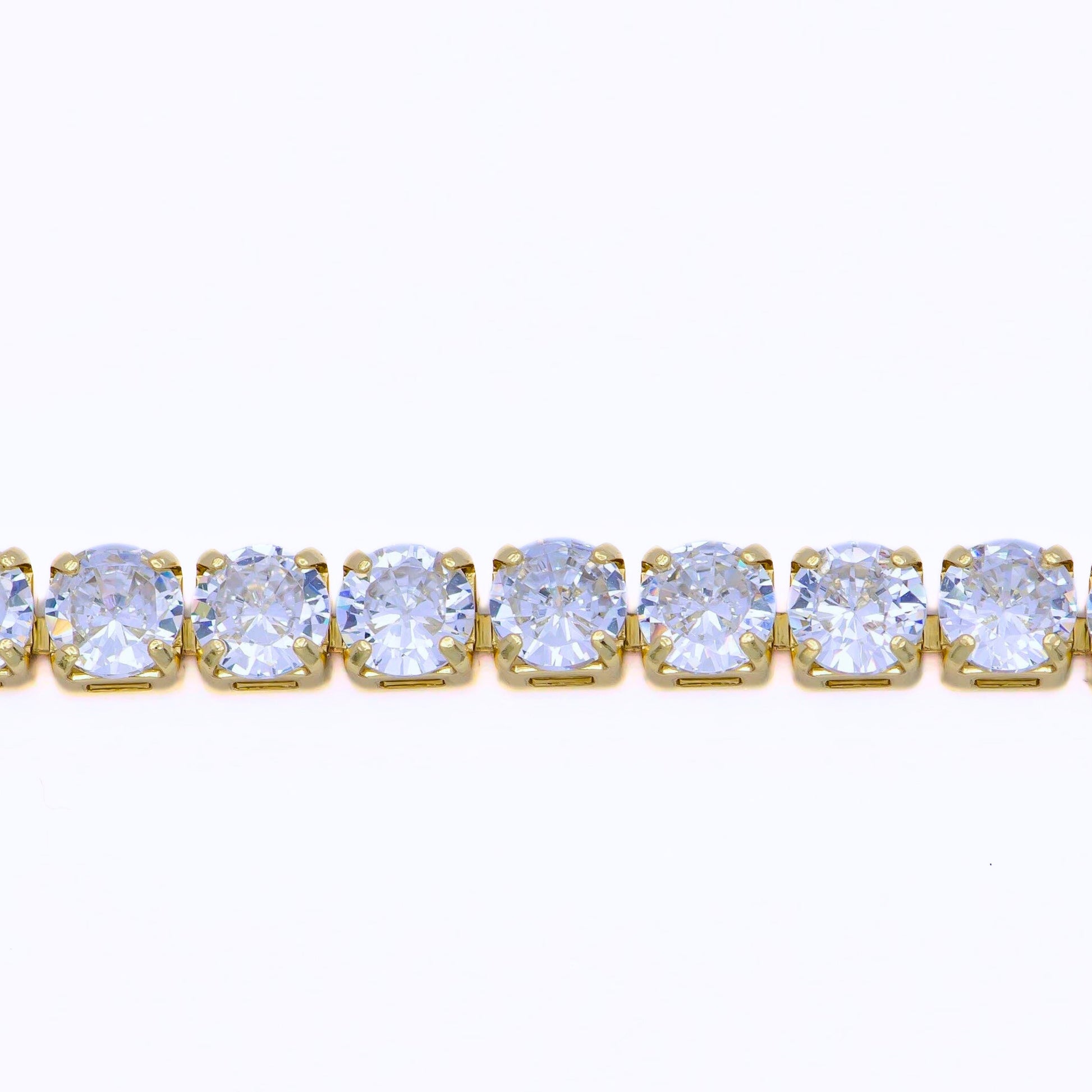 a yellow gold tennis bracelet with a row of CZ diamonds