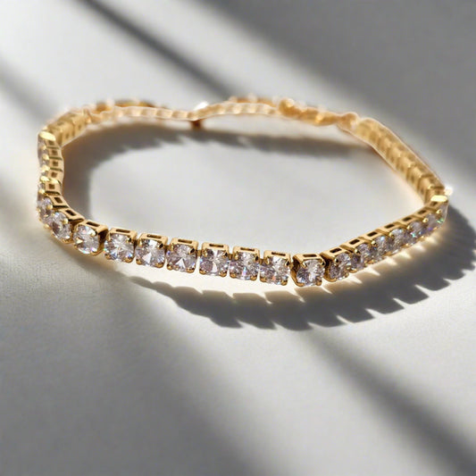 a cz diamond tennis bracelet on a white surface