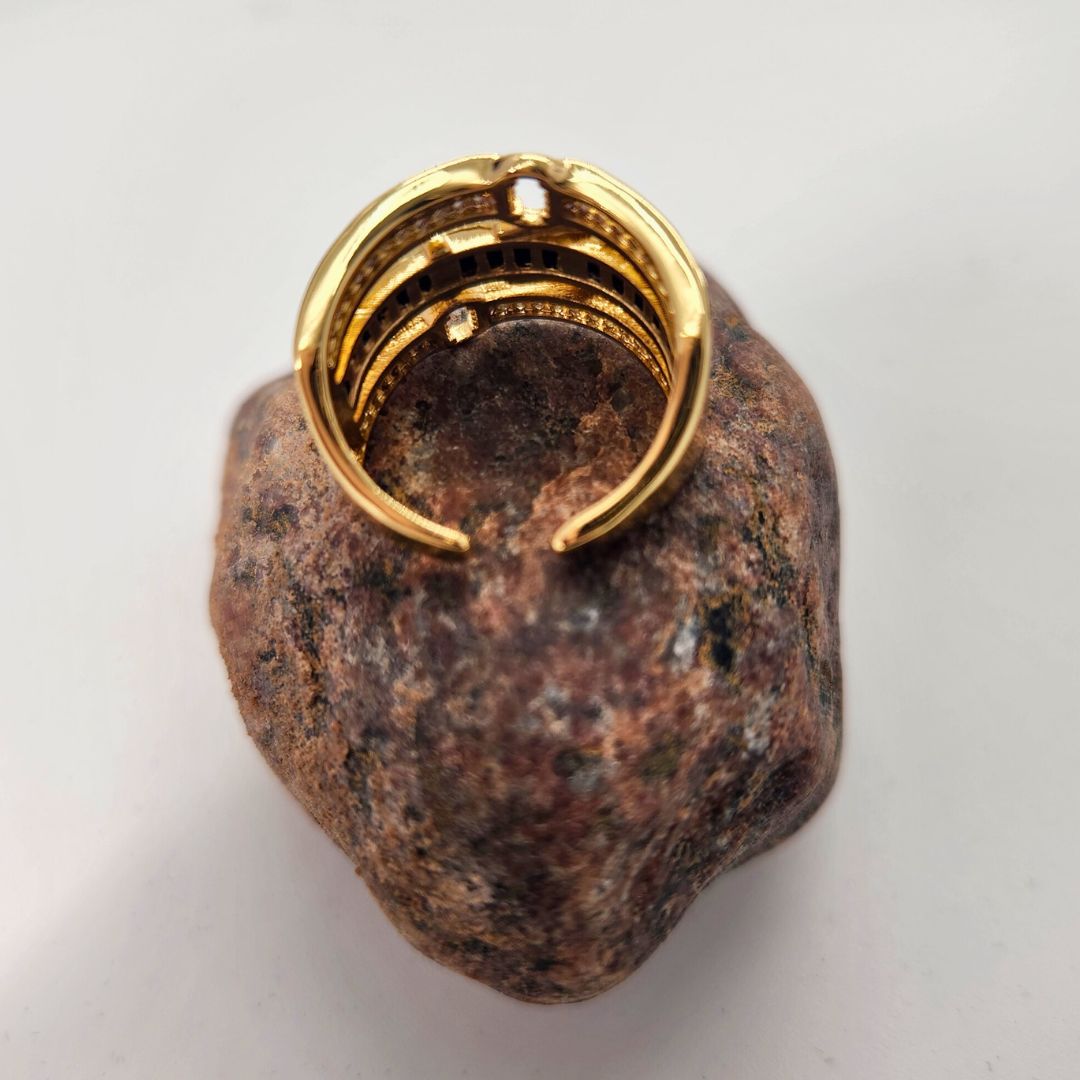 a rock with a ring on top of it