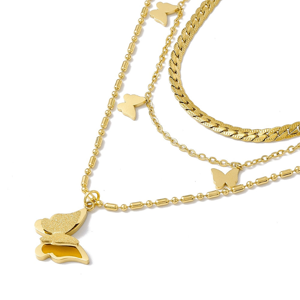 a gold necklace with a butterfly on it