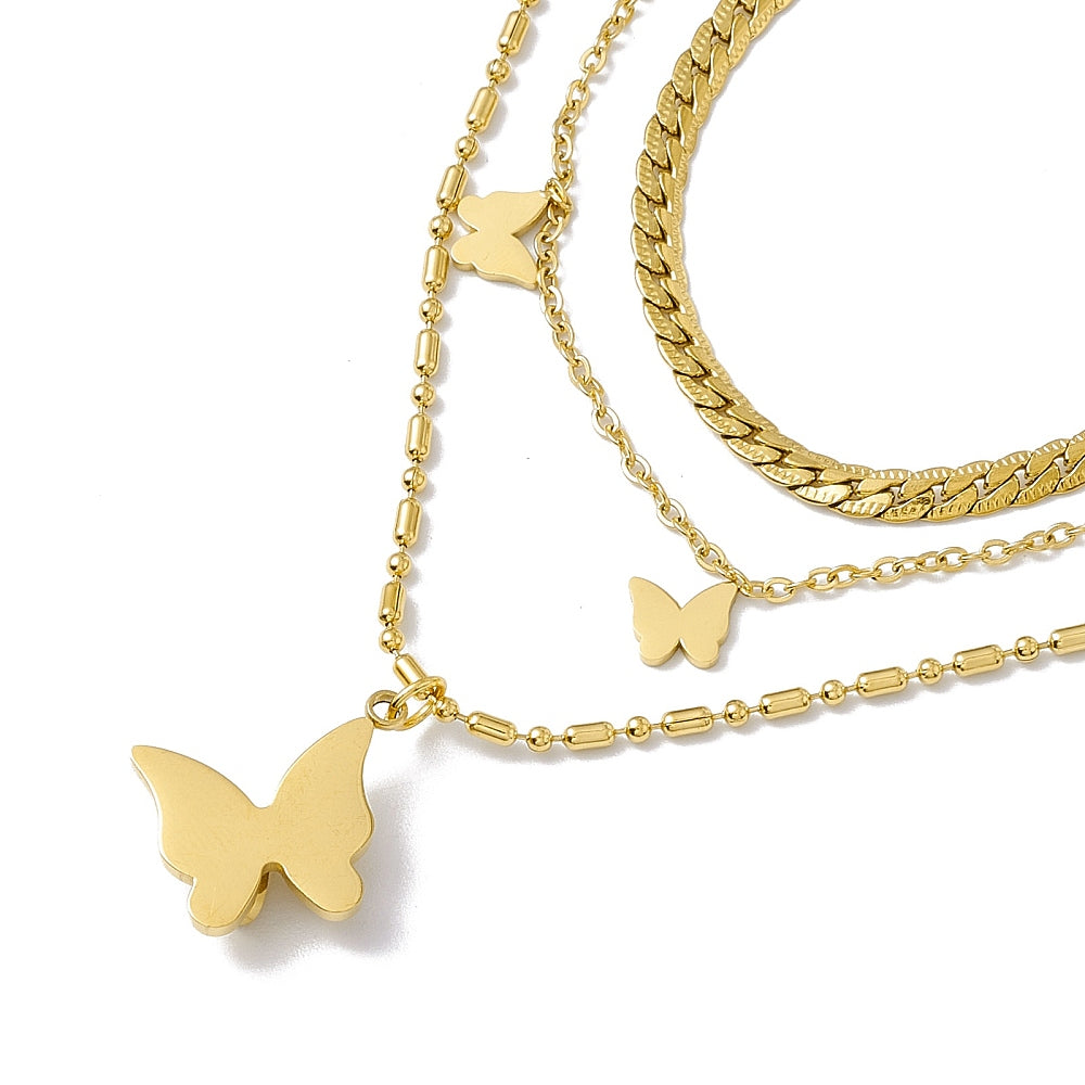 a gold necklace with a butterfly on it