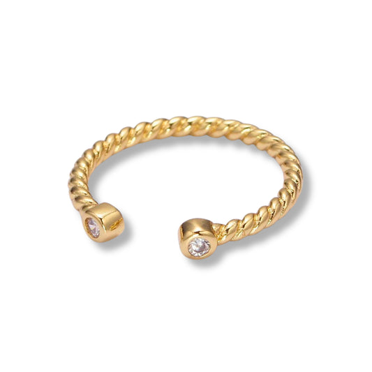 a gold open cuff ring with a diamond on it