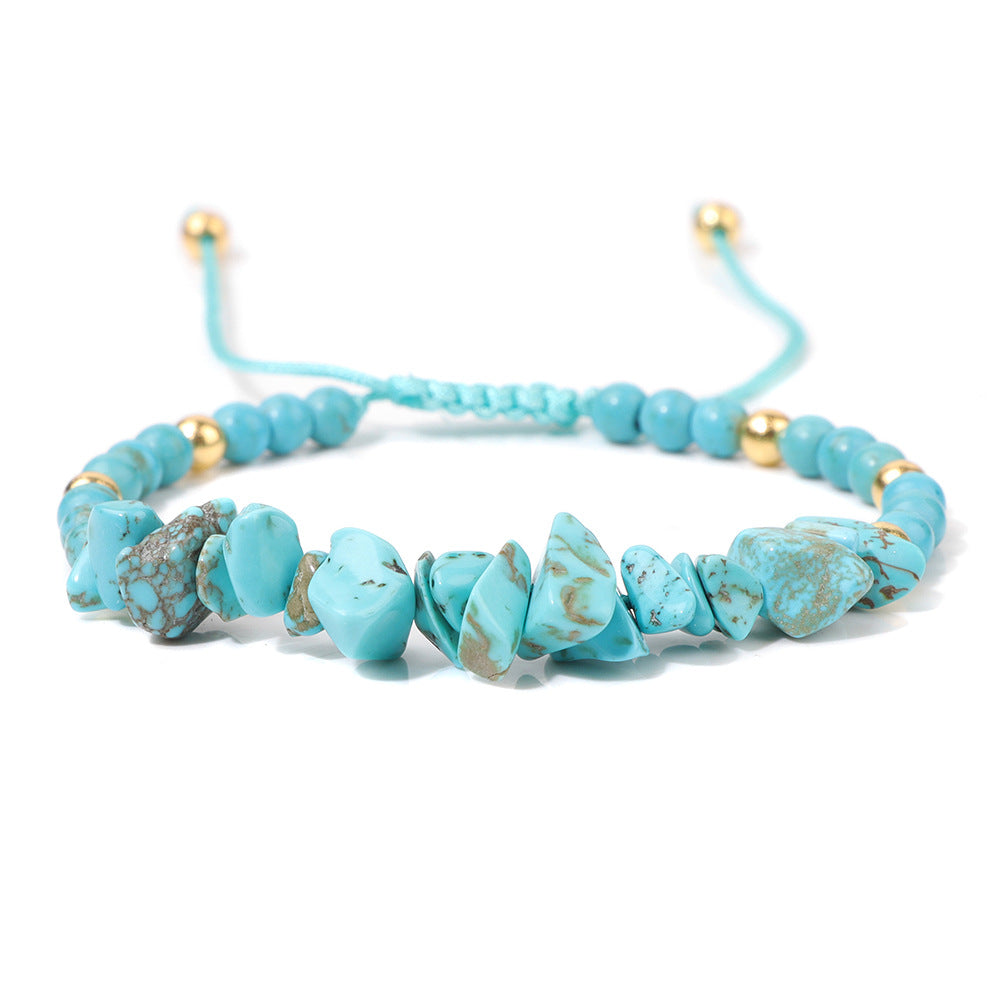 a bracelet with turquoise beads and gold beads