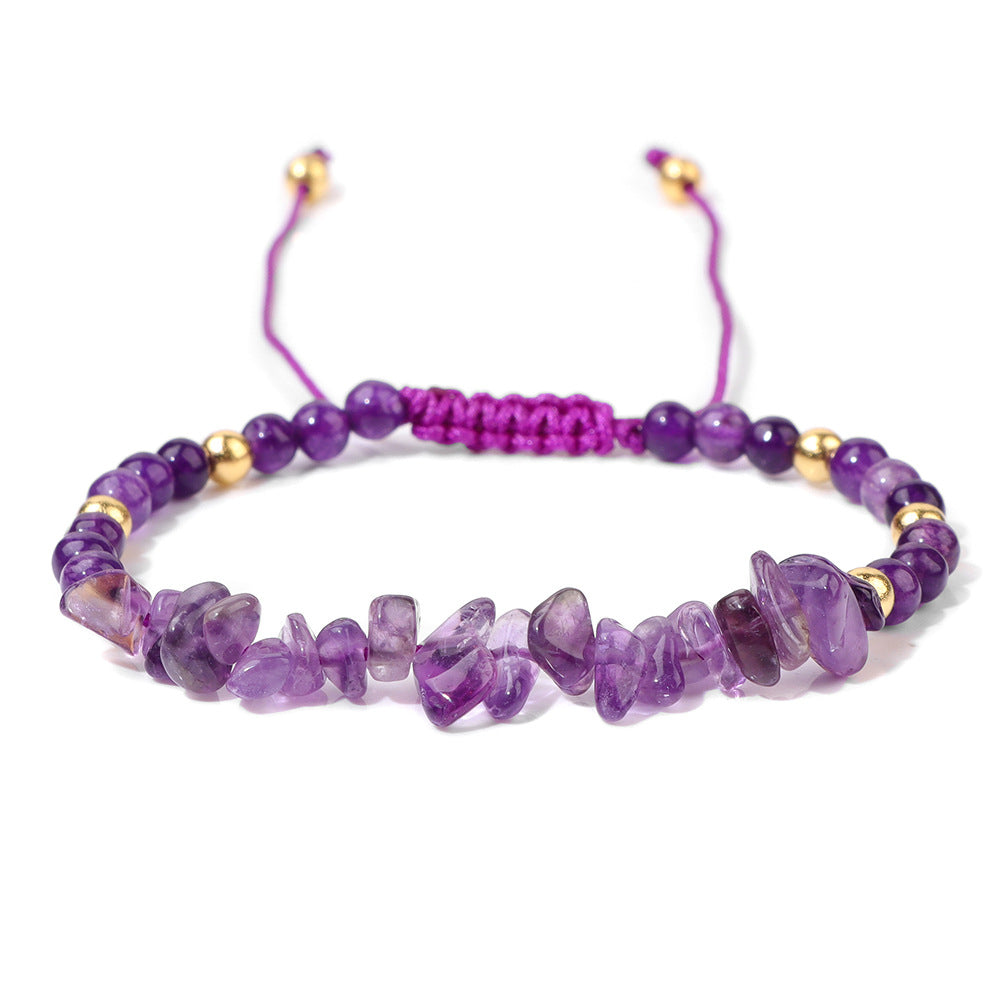 a purple beaded bracelet with gold accents