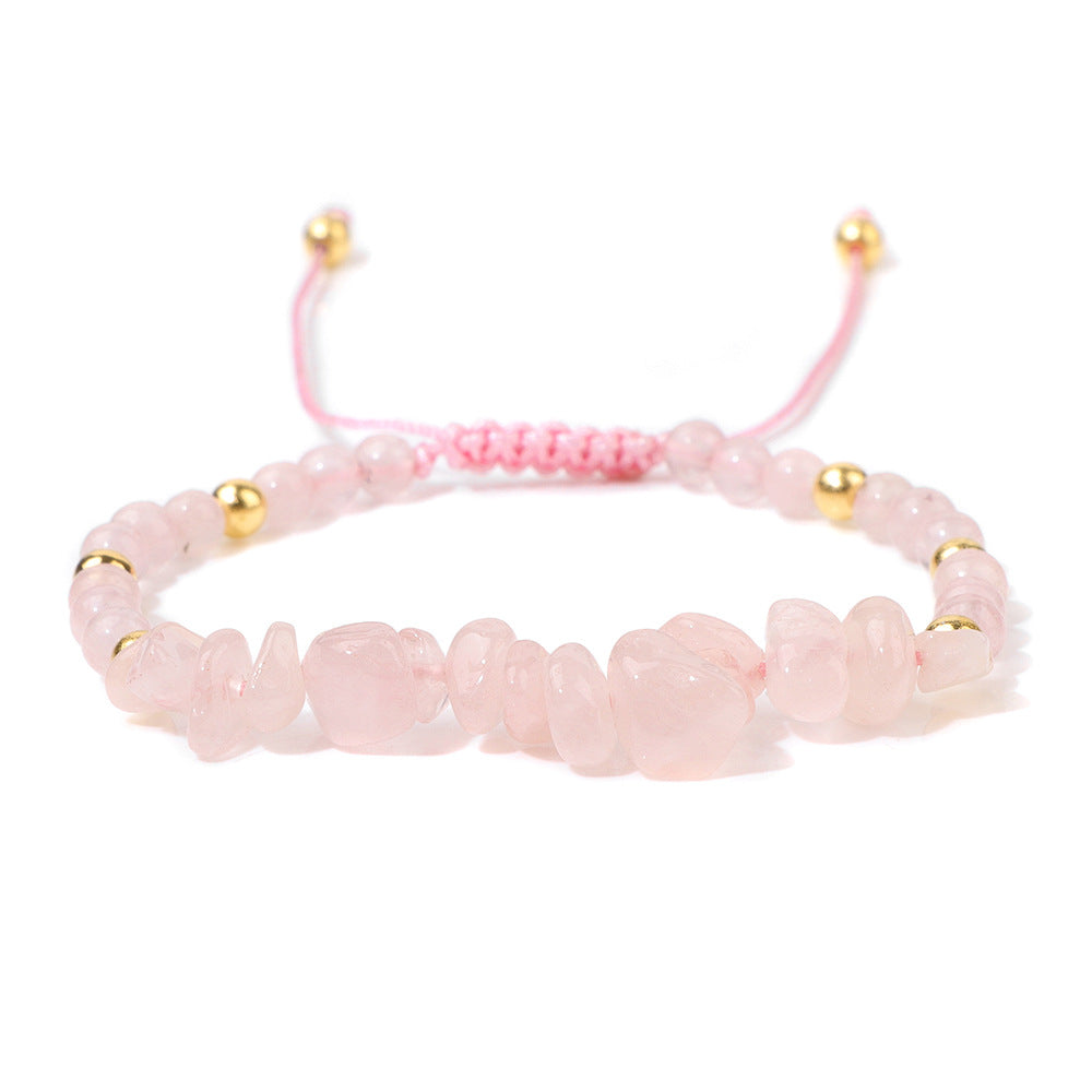 a pink beaded bracelet with gold beads