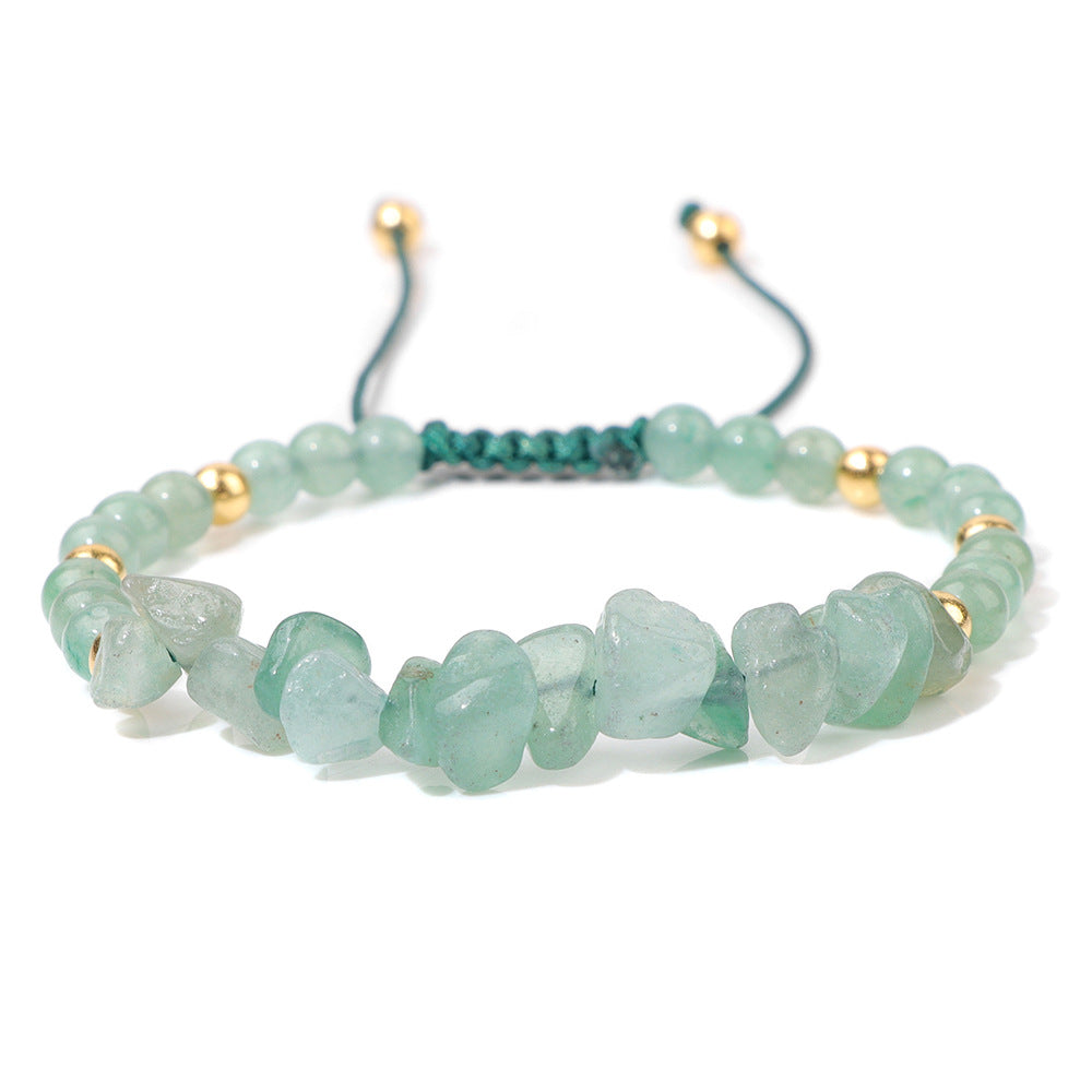 a bracelet with green beads and gold beads