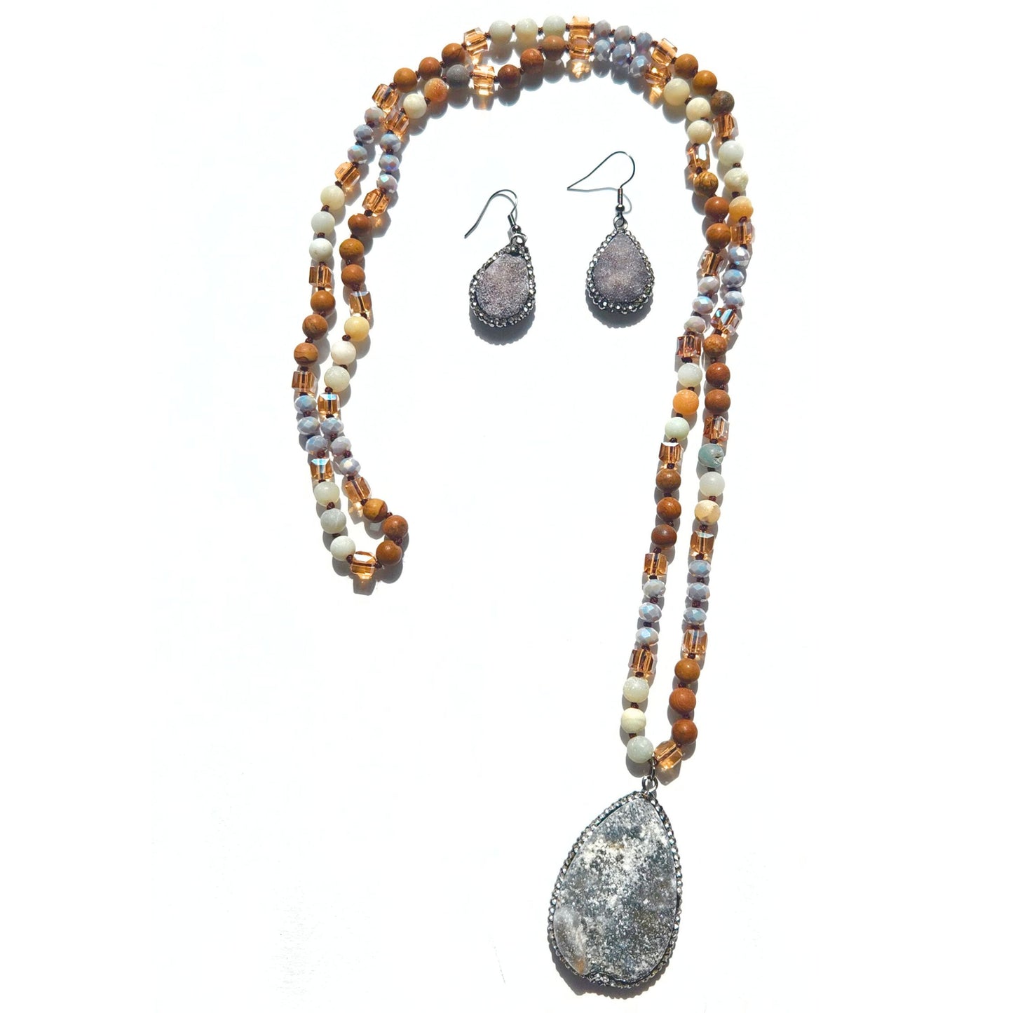 a necklace and earring set made of beads