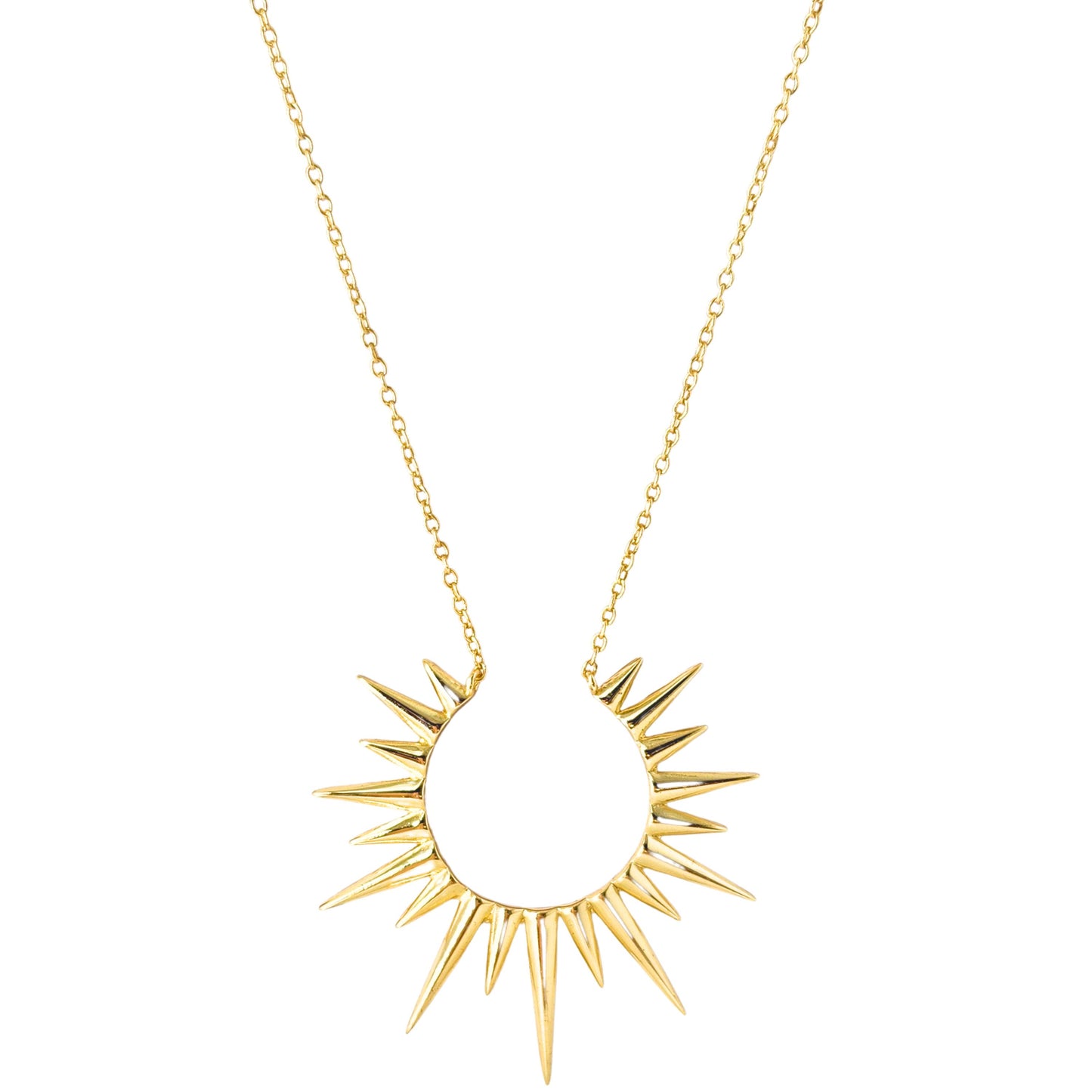 a gold necklace with spikes hanging from it